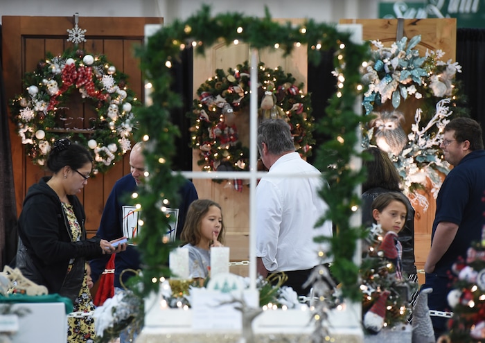 (Francisco Kjolseth  |  The Salt Lake Tribune)  People tour the Festival of Trees at the South Towne Exposition Center in Sandy on Friday, Dec. 1, 2017. The annual festival which runs through Saturday raises money for children at Primary Children's Hospital.
