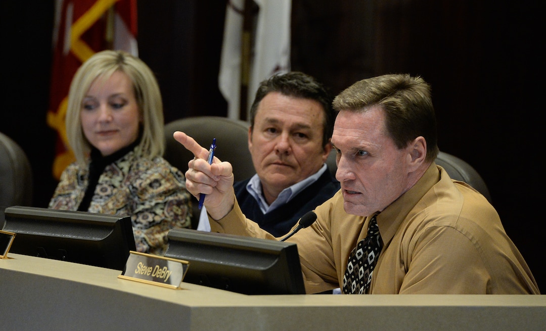 (Francisco Kjolseth  |  The Salt Lake Tribune) The Salt Lake County Council member Steve DeBry, right, explains his "no" vote alongside council members Aimee Winder Newton and Michael Jensen for the first of two votes on Tuesday, Feb. 25, 2020, on a set of zoning changes for Olympia Hills, the controversial new housing and commercial development proposed on unincorporated county land on Herriman's western border. The County Council approved the zoning changes 6-to-3, as residents from Herriman, Bluffdale and Riverton who oppose the project turned out for the hearing to voice their concerns.