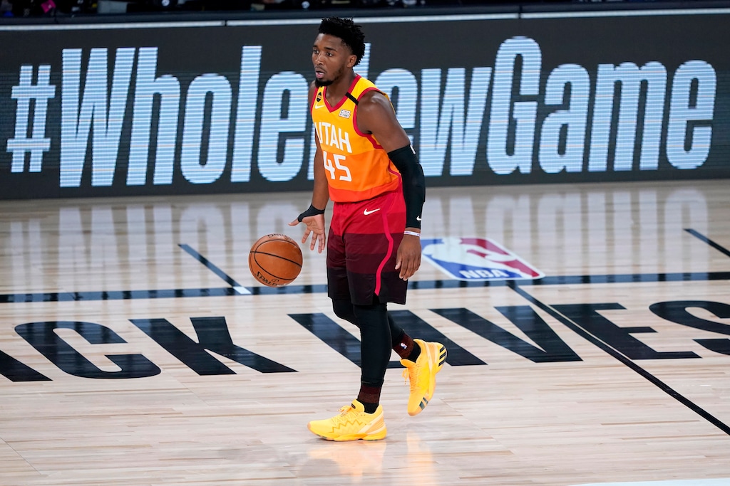 Utah Jazz's Donovan Mitchell (45) moves the ball up court against the Denver Nuggets during the first half of an NBA basketball first round playoff game Friday, Aug. 21, 2020, in Lake Buena Vista, Fla. (AP Photo/Ashley Landis, Pool)