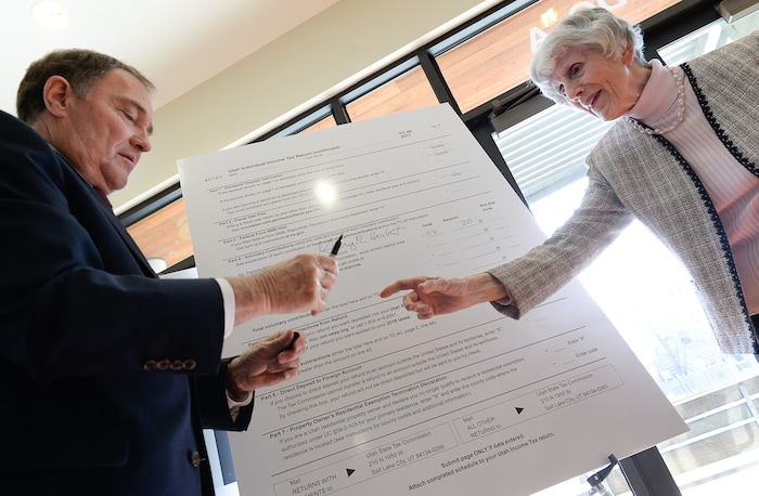 (Francisco Kjolseth | The Salt Lake Tribune) With the arrival of tax season, champion for the homeless Pamela Atkinson and Gov. Gary Herbert, gather at the YWCA Center for Women & Familes in Salt Lake on Tuesday, March 20, 2018, to encourage people to donate to the Pamela Atkinson Homeless Trust Fund on their tax forms as they demonstrate how easy it is to make a donation. All donations to the trust fund go directly to organizations statewide that help people experiencing homelessness.