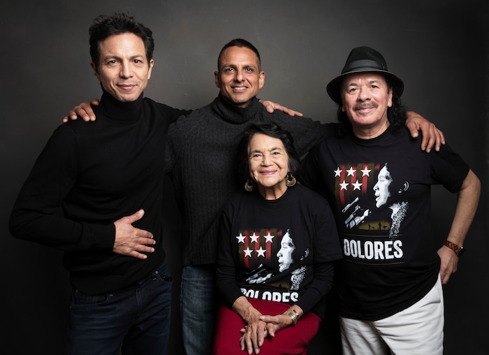 Consulting producer Benjamin Bratt, from left, director Peter Bratt, Dolores Huerta, and executive producer Carlos Santana pose for a portrait to promote the film, "Dolores", at the Music Lodge during the Sundance Film Festival on Friday, Jan. 20, 2017, in Park City, Utah. (Photo by Taylor Jewell/Invision/AP)