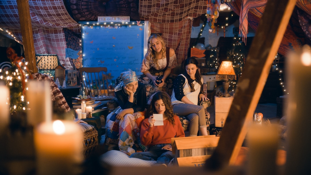 (Photo courtesy Pinnacle Peak Pictures) The older March sisters — clockwise from top, Amy (Taylor Murphy), Meg (Melanie Stone), Jo (Sarah Davenport) and Beth (Allie Jennings) — read old notes by their younger selves, in a scene from director Clare Niederpruem's modern-day adaptation of Louisa May Alcott's "Little Women."