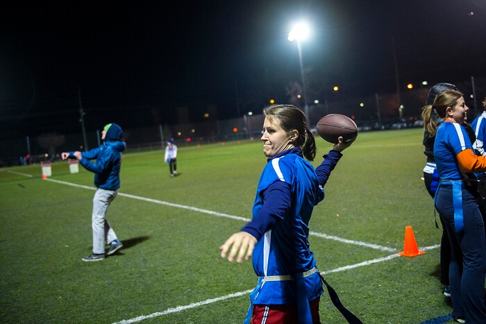 (Chris Detrick | The Salt Lake Tribune) Team A Lot quarterback Jenn Hartman warms up before the flag football team game against Sim Team at North University Fields in Provo Thursday, November 30, 2017.