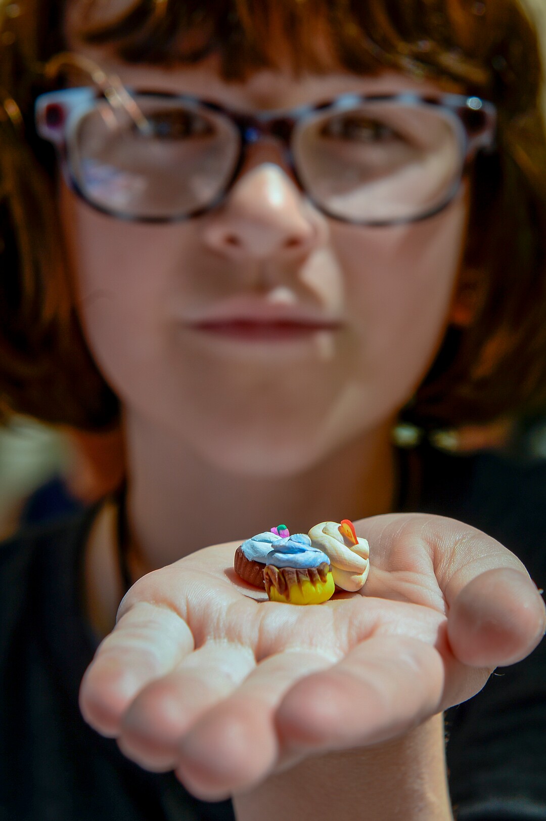 (Leah Hogsten  |  The Salt Lake Tribune) Imogen Nesse, 9, of Salt Lake City creates reproductions of food, including sushi, fudgesicles, cupcakes and heart-shaped waffles out of polymer clay at Craft Lake CityÕs DIY Festival Kid Row, where children 14 and under make and sell their products. Craft Lake CityÕs DIY Festival is UtahÕs largest local, three day arts festival with over 300 artisans, DIY engineers, vintage vendors and craft food creators.