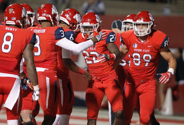 Fresno State's running back Jordan Mims (22) celebrates a touchdown with KeeSean Johnson (3) against BYU during the second half of an NCAA college football game in Fresno, Calif., Saturday, Nov. 4, 2017. Fresno State won the game 20-13. (AP Photo/Gary Kazanjian)