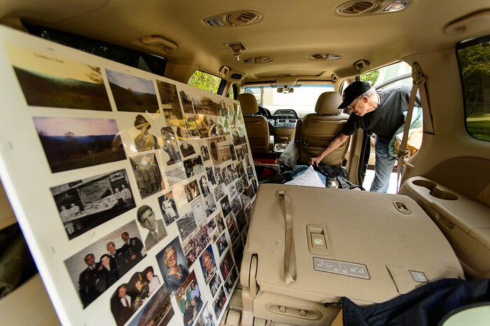 (Trent Nelson | The Salt Lake Tribune)  Don Jacobson packs up photos and blankets while evacuating his home as a fire burns at the mouth of Weber Canyon, Tuesday September 5, 2017.