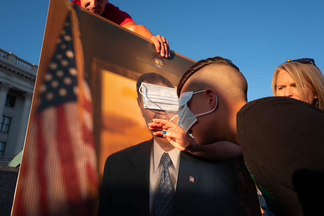 (Trent Nelson  |  The Salt Lake Tribune) Children play "pin the mask on Gov. Gary Herbert" at a rally protesting government mask mandates at the State Capitol in Salt Lake City on Saturday, Sept. 5, 2020.