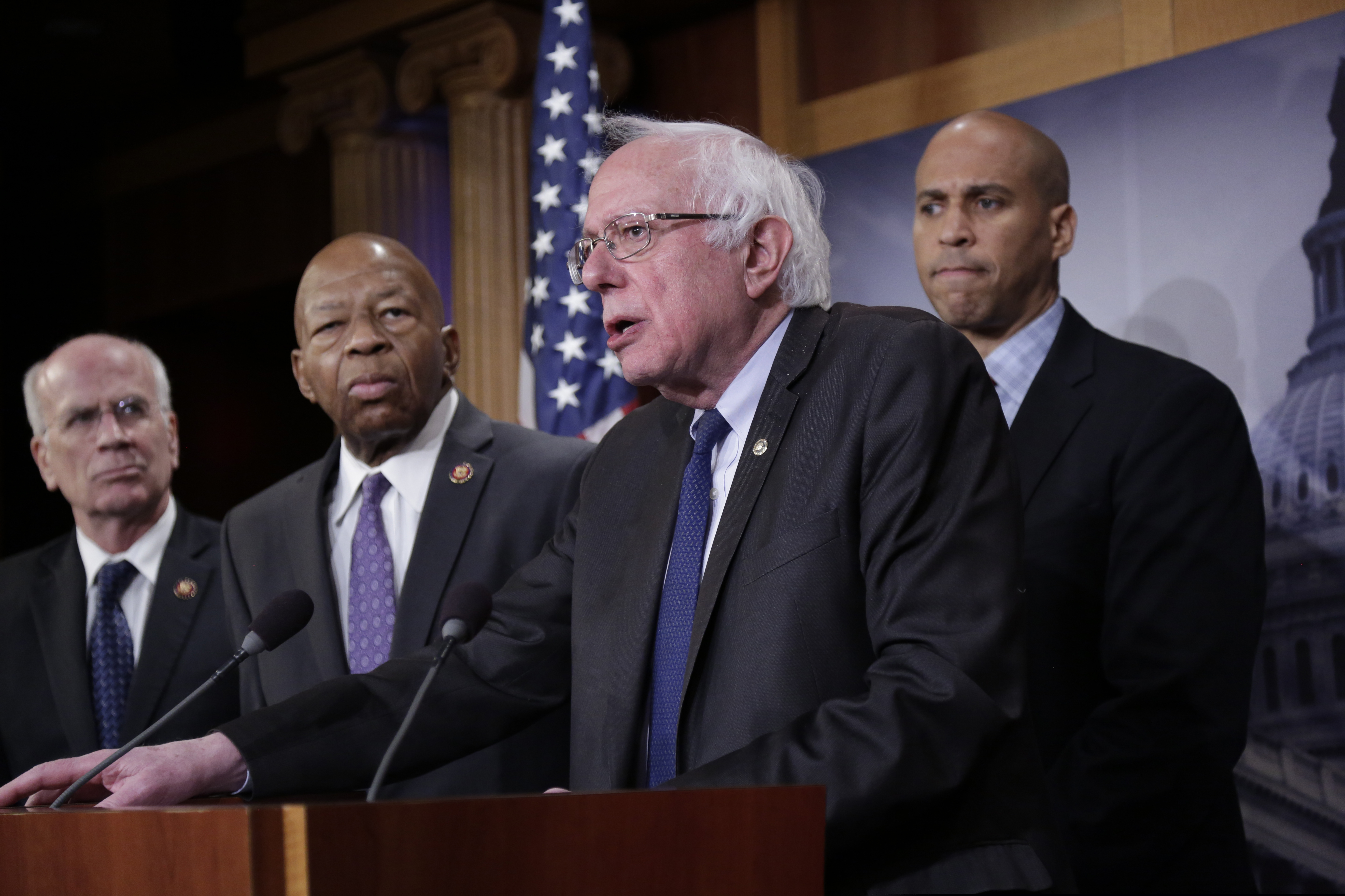 Sen. Bernie Sanders, I-Vt., center, joined from left by Rep. Peter Welch, D-Vt., Rep. Elijah Cummings, D-Md., and Sen. Cory Booker, D-N.J., speaks to reporters as he prepares to introduce new legislation that aims to reduce what Americans pay for prescription drugs, especially brand-name drugs deemed "excessively priced," during a news conference on Capitol Hill in Washington, Thursday, Jan. 10, 2019. (AP Photo/J. Scott Applewhite)