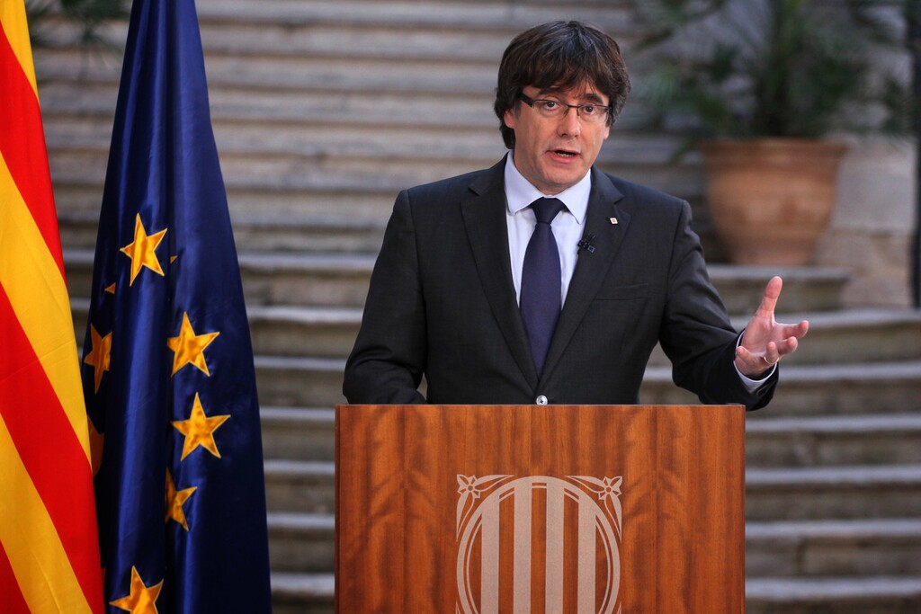 Catalan President Carles Puigdemont speaks during a statement at the Palau Generalitat in Barcelona, Spain, on Saturday, Oct. 28, 2017. Catalonia's separatist leader has called on Catalans to peacefully oppose Spain's takeover, in a staged appearance that seemed to convey that he refuses to accept his firing, which was ordered by central authorities (Presidency Press Service, Pool Photo via AP)