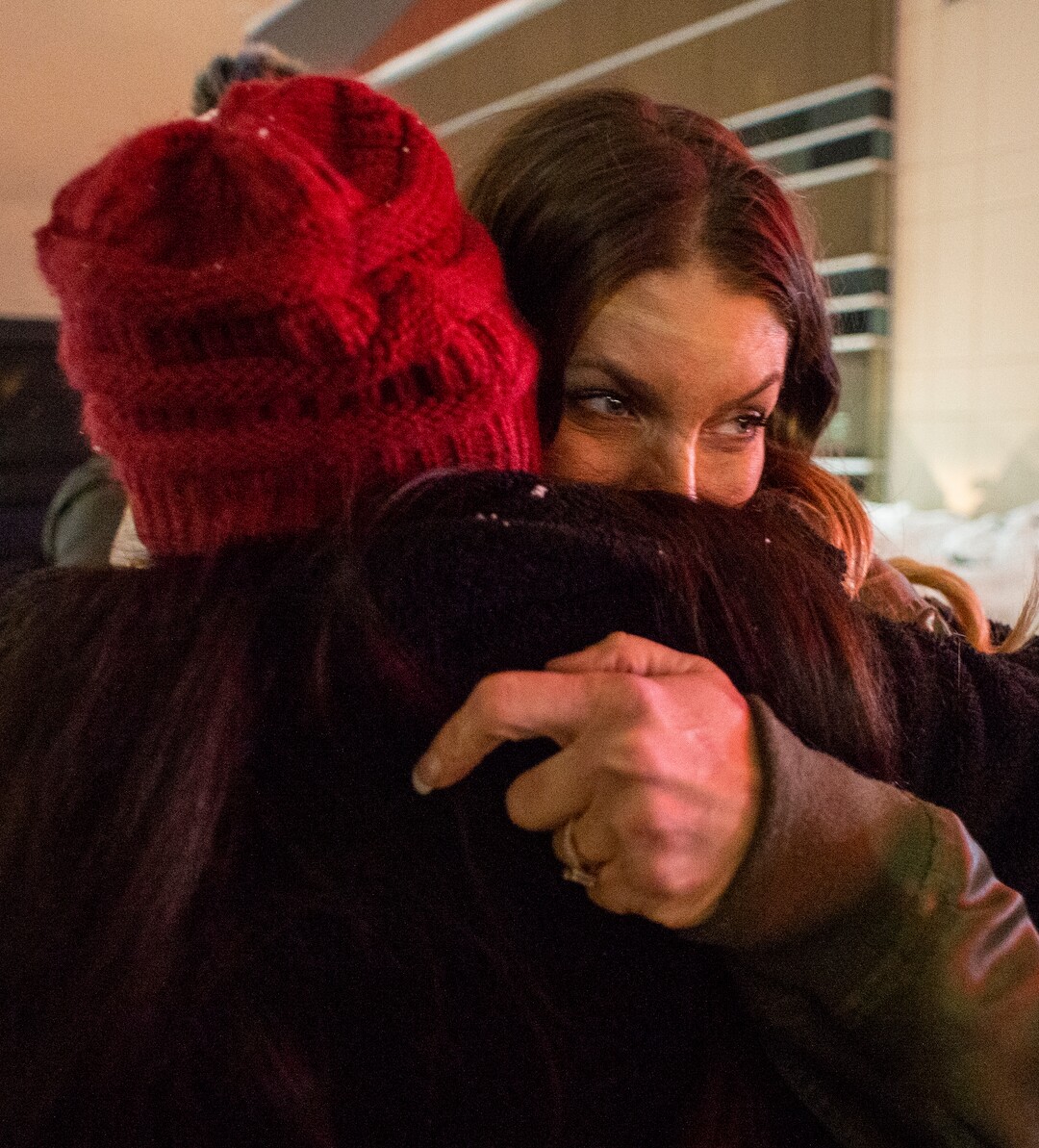 (Rick Egan  |  The Salt Lake Tribune)      Nikki Stokoe the wife of David Stokoe, hugs a friend during a vigil for David Stokoe, a real estate agent killed at one of his rentals last week. Monday, Jan. 21, 2019.