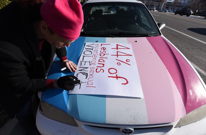 (Francisco Kjolseth | The Salt Lake Tribune) Rachel Edward joins other activists in Utah to protest Salt City Tattoo on Friday, Dec. 22, 2017, following an Instagram post made by the shop's official Instagram account. The post in question was of a gift provided during the shop's white elephant exchange, a gift one of the artists at the parlor called a "rape kit," containing leather gloves, black duct tape, a bottle of lubricant, rope, and a knife.