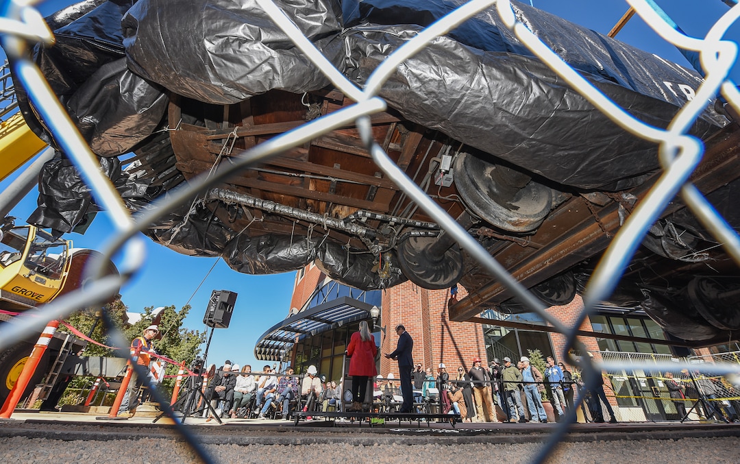 (Francisco Kjolseth  |  The Salt Lake Tribune)  The iconic trolley car, that has been sitting in storage for several years, is moved back into view at Trolley Square on Monday, Oct. 15, 2018 as people gather for the repositioning ceremony. The empty trolley car, last seen housing the Trolley Wing Company was moved into place on the north plaza by Pottery Barn.