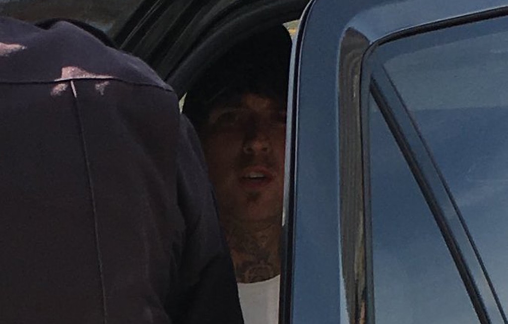 (photo courtesy KUTV) Austin J. Boutain is put in the back of a car after he was arrested on Tuesday, Oct 31, 2017.
