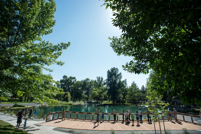 (Rick Egan  |  The Salt Lake Tribune)       Kids fish at Fairmont Park Pond, during the grand reopening celebration, Wednesday, June 27, 2018.