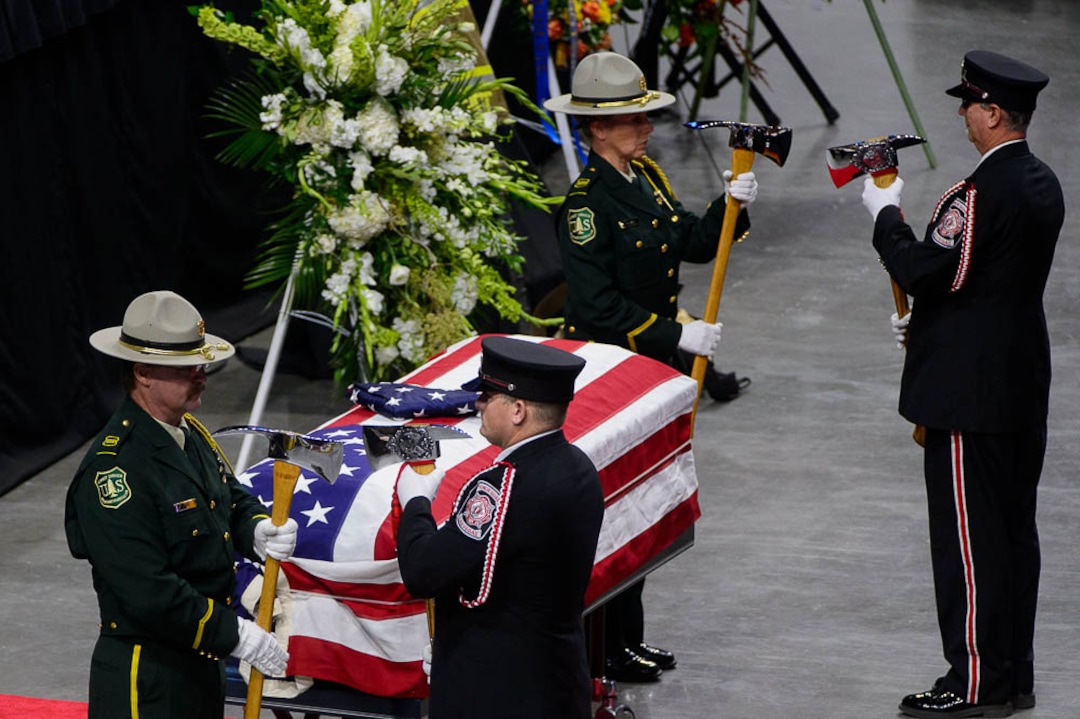 (Trent Nelson | The Salt Lake Tribune)  Funeral services for Battalion Chief Matthew Burchett at the Maverik Center in West Valley City, Monday Aug. 20, 2018.