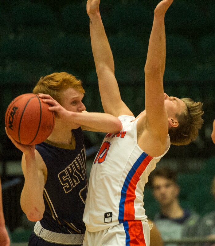 (Rick Egan | The Salt Lake Tribune) Skyline Eagles Andrew Clark (24) is guarded by Timpview Thunderbirds Ethan Lott (10), in 5A basketball playoff action between the Timpview Thunderbirds and at the Skyline Eagles, at the UCCU Center in Orem, Monday, Feb. 26, 2018.