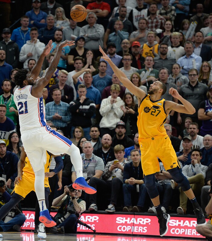 (Francisco Kjolseth  |  The Salt Lake Tribune)  Philadelphia 76ers center Joel Embiid (21) goes for three over Utah Jazz center Rudy Gobert (27) as the Utah Jazz host the Philadelphia 76ers in their NBA basketball game at Vivint Smart Home Arena in Salt Lake City on Wednesday Nov. 6, 2019.