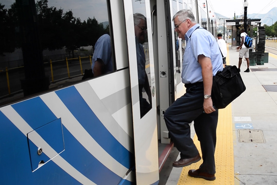 (Rick Egan  |  The Salt Lake Tribune)      Salt Lake Tribune writer Lee Davidson boards TRAX at Library Square in a transportation race from Library Square to the Tribune building at the Gateway on Thursday, Aug. 2, 2018.  