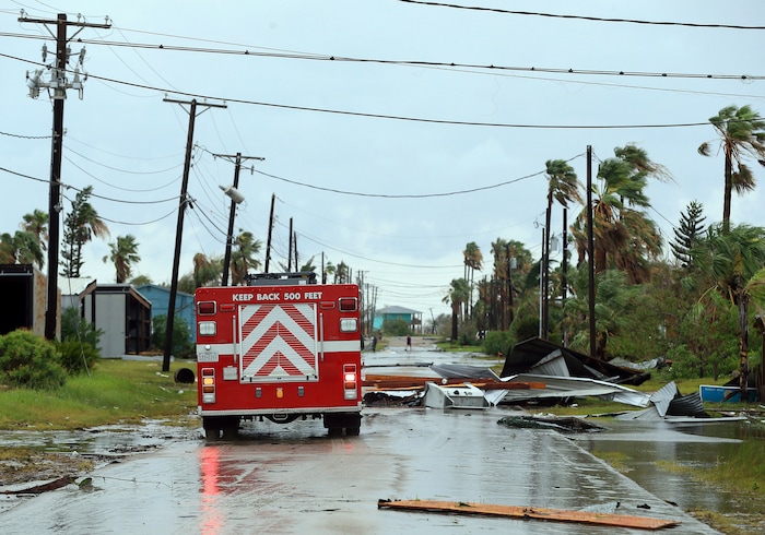 (Gabe Hernandez | Corpus Christi Caller-Times via AP) Port Aransas Fire Department survey the area after Hurricane Harvey landed in the Coast Bend area on Saturday, Aug. 26, 2017, in Port Aransas, Texas. The National Hurricane Center has downgraded Harvey from a Category 1 hurricane to a tropical storm. Harvey came ashore Friday along the Texas Gulf Coast as a Category 4 storm with 130 mph winds, the most powerful hurricane to hit the U.S. in more than a decade.