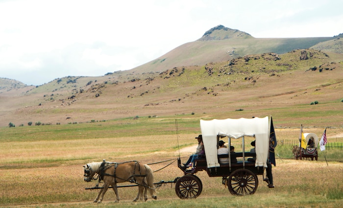 (Rick Egan  |  The Salt Lake Tribune)   Covered wagon rides at the 13th Annual Cowboy Legends, Music & Poetry Festival at the Historic Fielding Garr Ranch on Antelope Island, Sunday, May 27, 2018. The Festival continues through Monday.