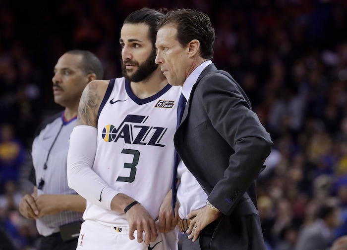 Utah Jazz head coach Quin Snyder, right, talks with guard Ricky Rubio (3) during the second half of an NBA basketball game against the Golden State Warriors in Oakland, Calif., Sunday, March 25, 2018. (AP Photo/Jeff Chiu)