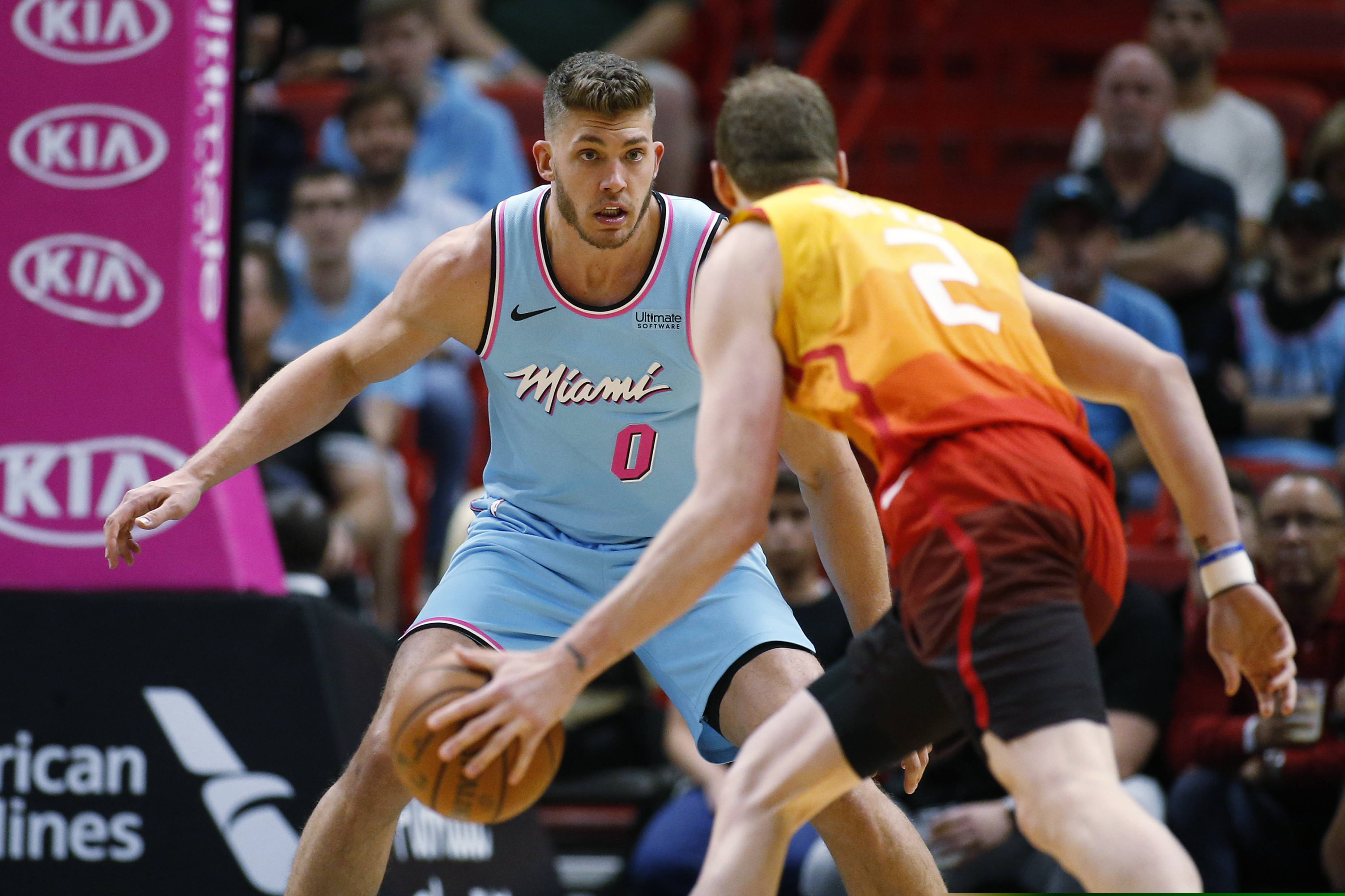 Miami Heat forward Meyers Leonard (0) defends against Utah Jazz forward Joe Ingles (2) as he dribbles the ball during the first half of an NBA basketball game, Monday, Dec. 23, 2019, in Miami. (AP Photo/Joel Auerbach)