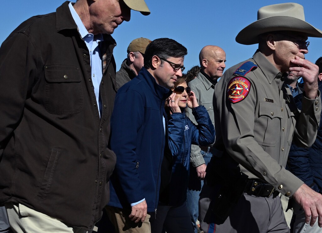(Kenny Holston | The New York Times) House Speaker Mike Johnson (R-La.), center, leads a delegation of House Republicans on a visit to the southern border in Eagle Pass, Texas, on Wednesday, Jan. 3, 2023.