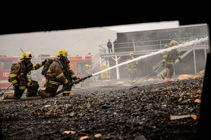 (Trent Nelson  |  The Salt Lake Tribune)  
Unified Fire recruits in a live response to a vehicle and structure fire at the Unified Fire Authority Training Center in Magna on Tuesday April 16, 2019.