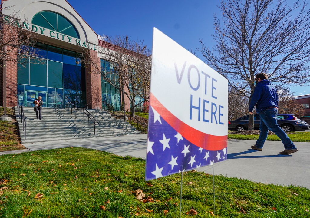 (Leah Hogsten | The Salt Lake Tribune) Voters walk in and out of Sandy City Hall on election day, Nov. 2, 2021.