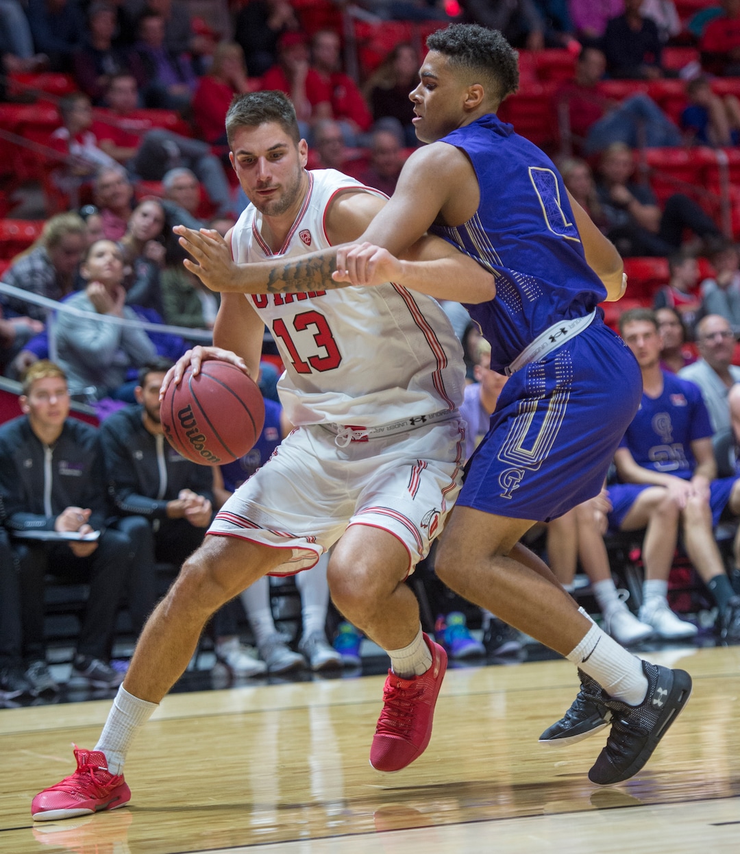(Rick Egan  |  The Salt Lake Tribune)  Utah Utes forward Novak Topalovic (13) takes the ball inside, as Jalen Galloway (0) College of Idaho, defends, in basketball action, between the Utah Utes and the College of Idaho Yotes at the Jon M. Huntsman Center, Thursday, Nov. 1, 2018.
