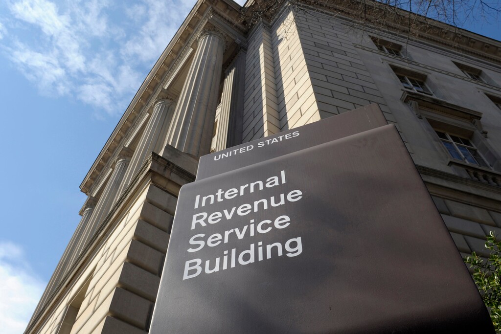 FILE - The Internal Revenue Service building stands in Washington on March 22, 2013. The rapidly expanding landscape of nonprofit collectives paying college athletes to promote charities has been hit with a potentially seismic disruption. A 12-page memo from the Internal Revenue Service released in June 2023 determined that in many cases, the nonprofit collectives may not qualify as tax-exempt if their main purpose is paying players instead of supporting charitable works. (AP Photo/Susan Walsh, File)