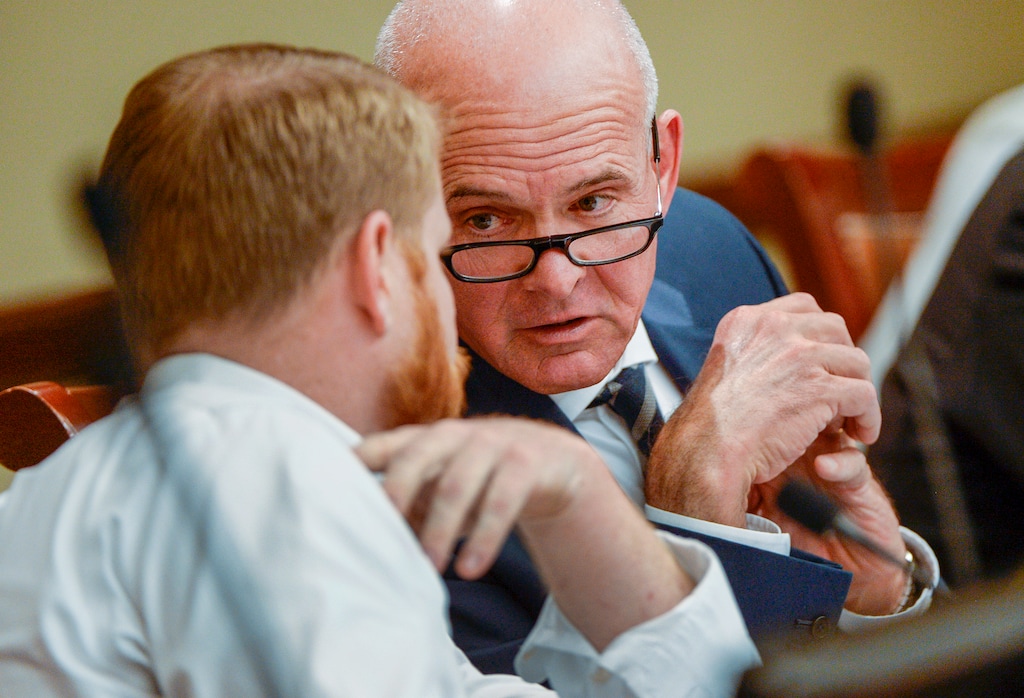 (Leah Hogsten | The Salt Lake) Tribune Carlos Braceras, Inland Port Authority board member and Executive Director of the Department of Transportation confers with James Rogers, Salt Lake City Council member, Sept. 26, 2018. Before the Inland Port board met Wednesday, a coalition of community, environmental and civic organizations have raised a separate transparency issue, noting that the group’s proposed half-page budget lacks specificity. The coalition wants to see the board acknowledge concern within the community, provide more details about its budget and fund an investigation into potential environmental harms from development of the port.