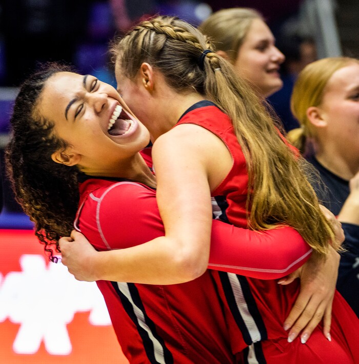 (Rick Egan | The Salt Lake Tribune) Jordyn Harvey hugs Lizzy Mcconkie, as  the Bountiful Redhawks defeat the Springville Red Devils, at Weber State,  for the Girls 5A State Championship at Weber State, on Saturday, March 4, 2023.
