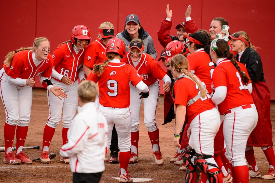 (Trent Nelson | The Salt Lake Tribune)  Utah Utes host the BYU Cougars, NCAA softball in Salt Lake City, Wednesday April 18, 2018. Utes celebrate Utah infielder Ryley Ball's home run.
