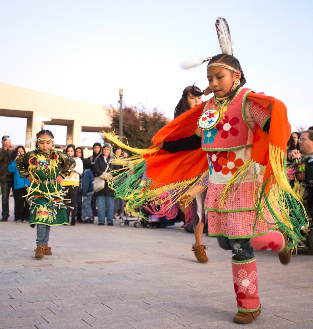 (Rick Egan  |  The Salt Lake Tribune)  Alyssa Dashee, 7, and Kayla Dashee, 10 of Holladay, dance, during the Indigenous Peoples Day celebration, hosted by the Utah League of Native American Voters and PANDOS (Peaceful Advocates for Native Dialogue and Organizing Support) at the Salt Lake City Library, Monday, October 9, 2017.