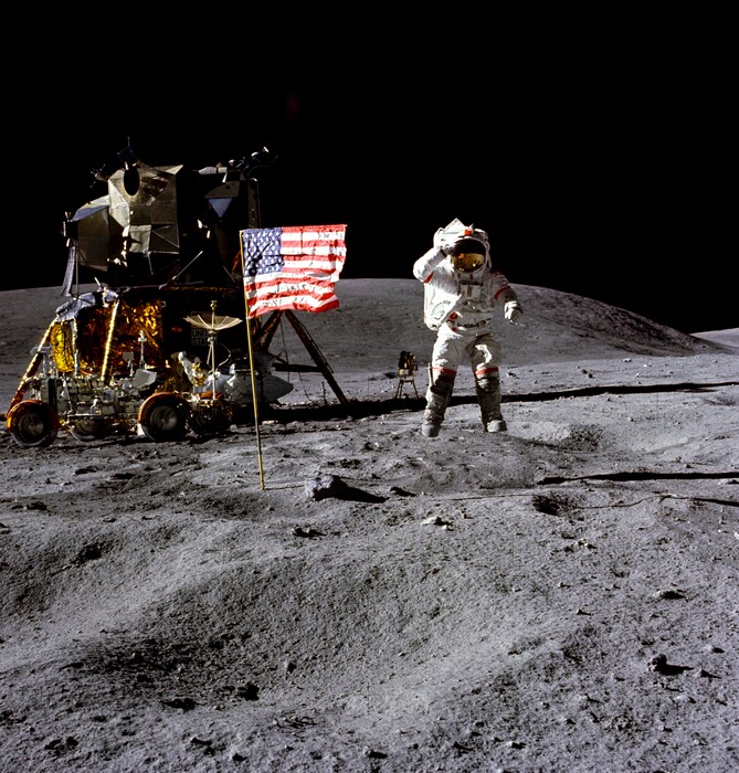 In this April 1972 photo made available by NASA, John Young salutes the U.S. flag at the Descartes landing site on the moon during the first Apollo 16 extravehicular activity. NASA says the astronaut, who walked on the moon and later commanded the first space shuttle flight, died on Friday, Jan. 5, 2018. He was 87. (Charles M. Duke Jr./NASA via AP)