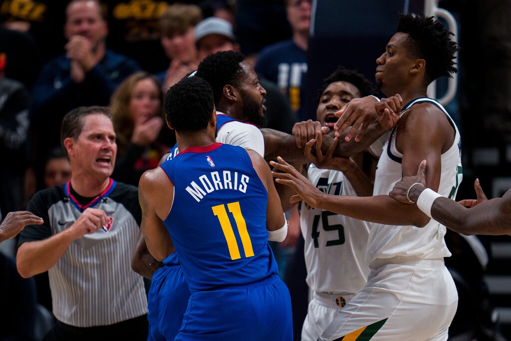 (Trent Nelson | The Salt Lake Tribune) Denver Nuggets forward JaMychal Green (0) and Utah Jazz center Hassan Whiteside (21) confront each other before both being ejected as the Utah Jazz host the Denver Nuggets, NBA basketball in Salt Lake City on Tuesday, Oct. 26, 2021.
