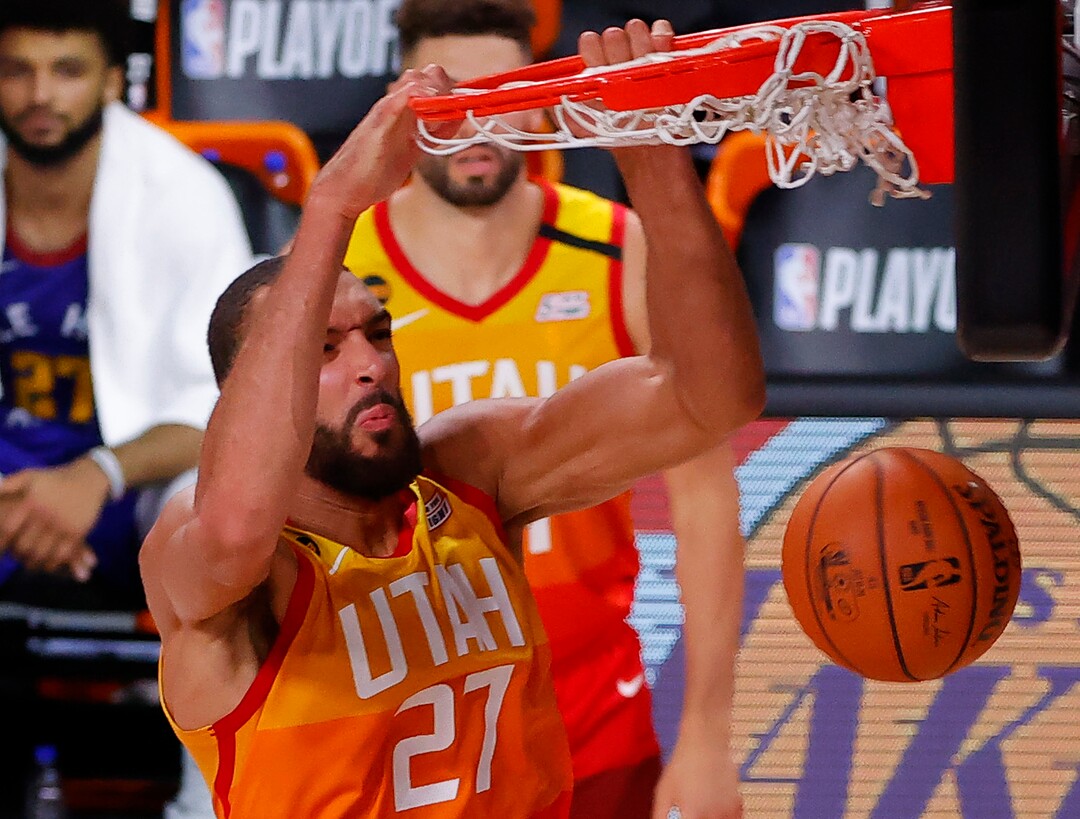 Utah Jazz's Rudy Gobert dunks against the Denver Nuggets during the third quarter in Game 4 of an NBA basketball first-round playoff series, Sunday, Aug. 23, 2020, in Lake Buena Vista, Fla. (Kevin C. Cox/Pool Photo via AP)
