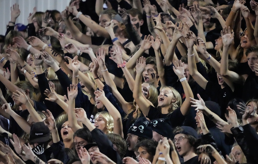 (Francisco Kjolseth | The Salt Lake Tribune) The Corner Canyon student section sings along to Neil Diamond’s  Touching You Touching Me song during the game between the Corner Canyon Chargers and the Skyridge Falcons, on Friday, Sept. 24, 2021, in Draper.