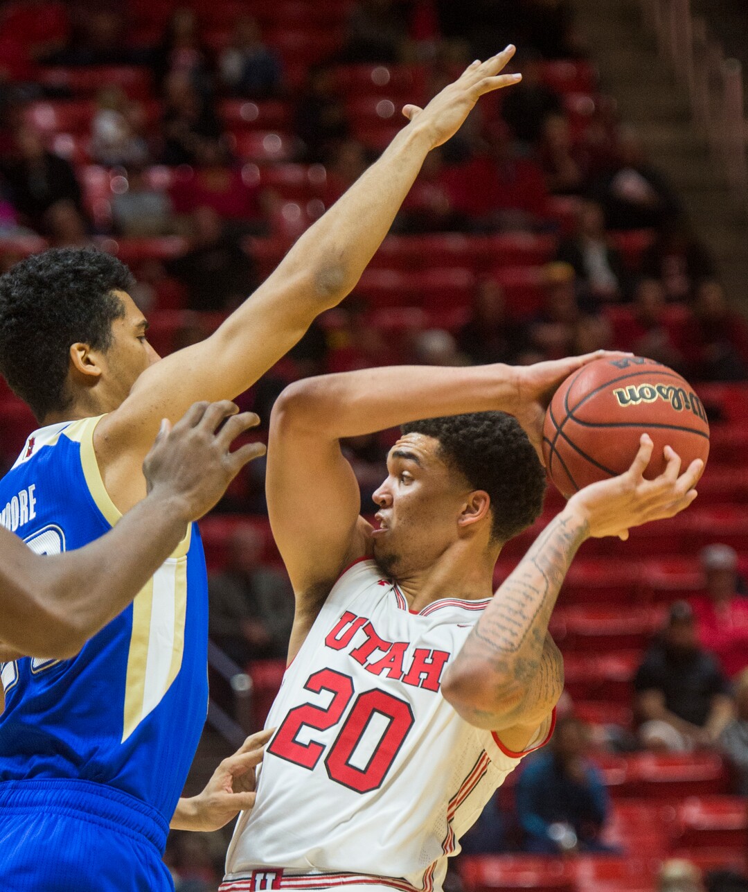 (Rick Egan  |  The Salt Lake Tribune)   Utah Utes forward Timmy Allen (20) controls the ball under pressure from Tulsa Golden Hurricane guard Zeke Moore (23), in basketball action between, Utah Utes and Tulsa Golden Hurricane, at the Jon M. Huntsman Center, Saturday, Dec. 1, 2018.