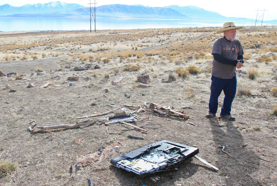 Steven Acerson, the president of the Utah Rock Art Research Association, stands near an area used as a shooting range on Thursday, Feb. 8, 2018, in the Lake Mountains area of Utah. A television was brought out to the area and used as a target. (Evan Cobb/The Daily Herald via AP)