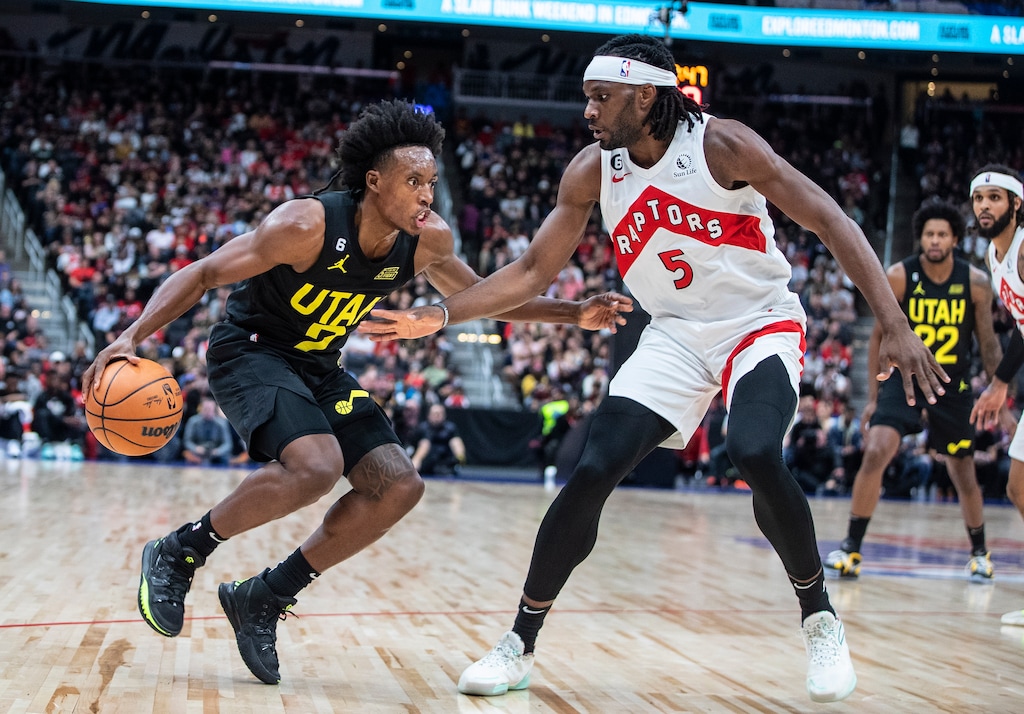 Utah Jazz's Collin Sexton (2) tries to get past Toronto Raptors' Precious Achiuwa (5) during first-half preseason NBA basketball game action in Edmonton, Alberta, Sunday, Oct. 2, 2022. (Jason Franson/The Canadian Press via AP)