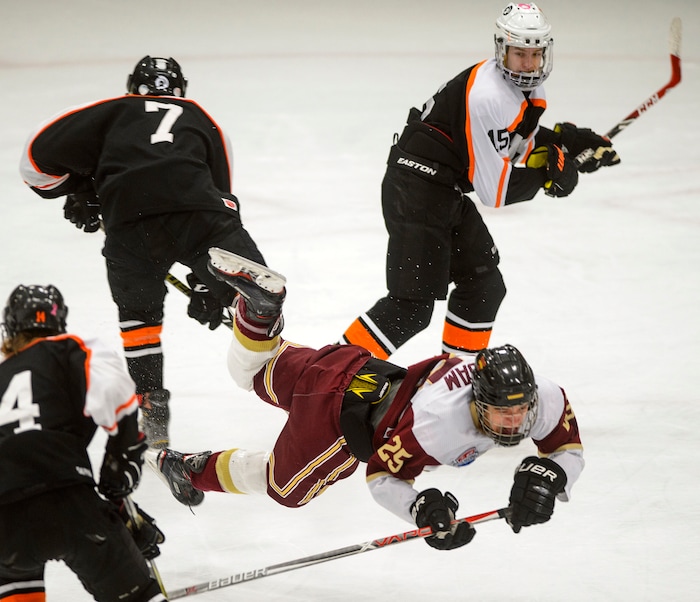 (Steve Griffin  |  The Salt Lake Tribune) Viewmont's  Zac Boam gets tripped by the Murray defense during the Division 1 ice hockey state title game at the Salt Lake City Sports Complex in Salt Lake City Tuesday Feb. 20, 2018.