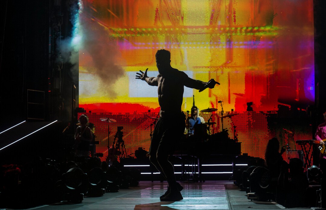 (Rick Egan  |  The Salt Lake Tribune)     Dan Reynolds performs with Imagine Dragons, at the Loveloud Festival at Rice-Eccles Stadium, Saturday, July 28, 2018.