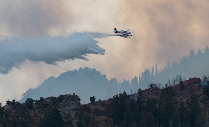 (Francisco Kjolseth  |  The Salt Lake Tribune) Air crews battle a fire in Neffs Canyon on the north side of Mount Olympus on Tuesday, Sept, 22, 2020.