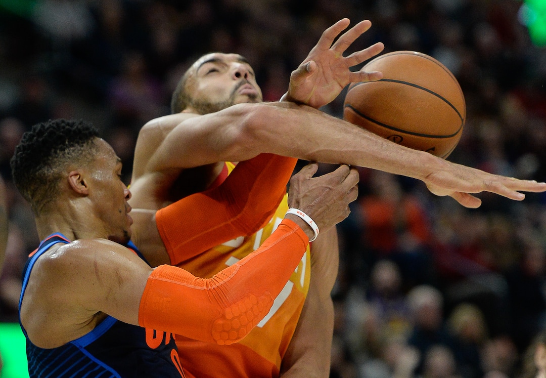 (Francisco Kjolseth  |  The Salt Lake Tribune)   Oklahoma City Thunder guard Russell Westbrook (0) puts the pressure on Utah Jazz center Rudy Gobert (27) in the NBA game at Vivint Smart Home Arena Sat., Dec. 22, 2018, in Salt Lake City.