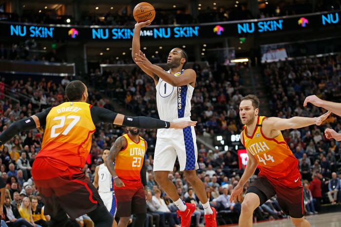 Indiana Pacers forward T.J. Warren (1) shoots as Utah Jazz's Rudy Gobert (27) and Bojan Bogdanovic (44) defend in the first half of an NBA basketball game Monday, Jan. 20, 2020, in Salt Lake City. (AP Photo/Rick Bowmer)