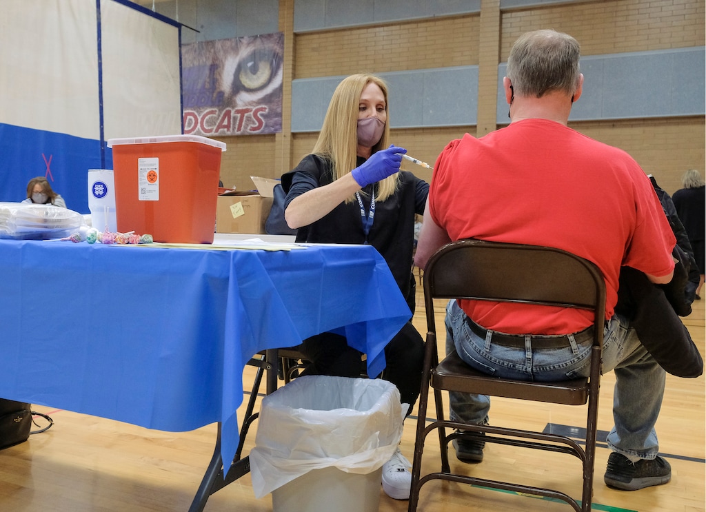 (Leah Hogsten | The Salt Lake Tribune) Nurse Angie Boren at a coronavirus vaccine site, Feb. 12, 2021. Utahns with a BMI over 30 are eligible for the vaccine beginning March 8, 2021.