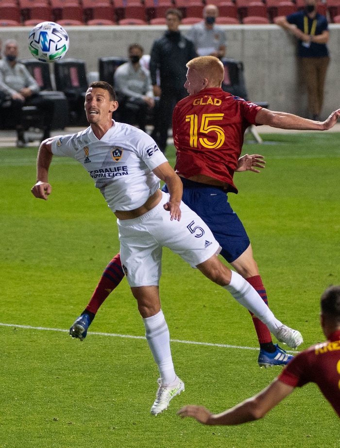 (Francisco Kjolseth  |  The Salt Lake Tribune) Los Angeles Galaxy defender Daniel Steres (5) goes for a header alongside Real Salt Lake defender Justen Glad (15) as Real Salt Lake hosts L.A. Galaxy at Rio Tinto Stadium in Sandy on Wednesday, Sept. 23, 2020.