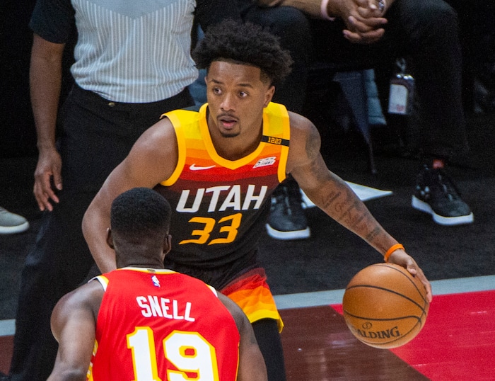 (Rick Egan | The Salt Lake Tribune) Utah Jazz forward Elijah Hughes (33) us guarded by Atlanta Hawks guard Tony Snell (19), in NBA action between the Utah Jazz and the Atlanta Hawks at Vivint Arena, on Friday, Jan. 15, 2021.